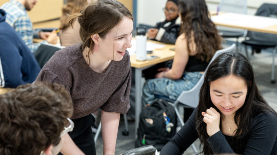 A color photo showing students working in groups.