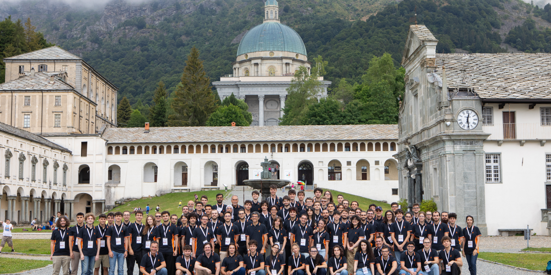A color photo showing a large group of students in front of an Italian cathederal.