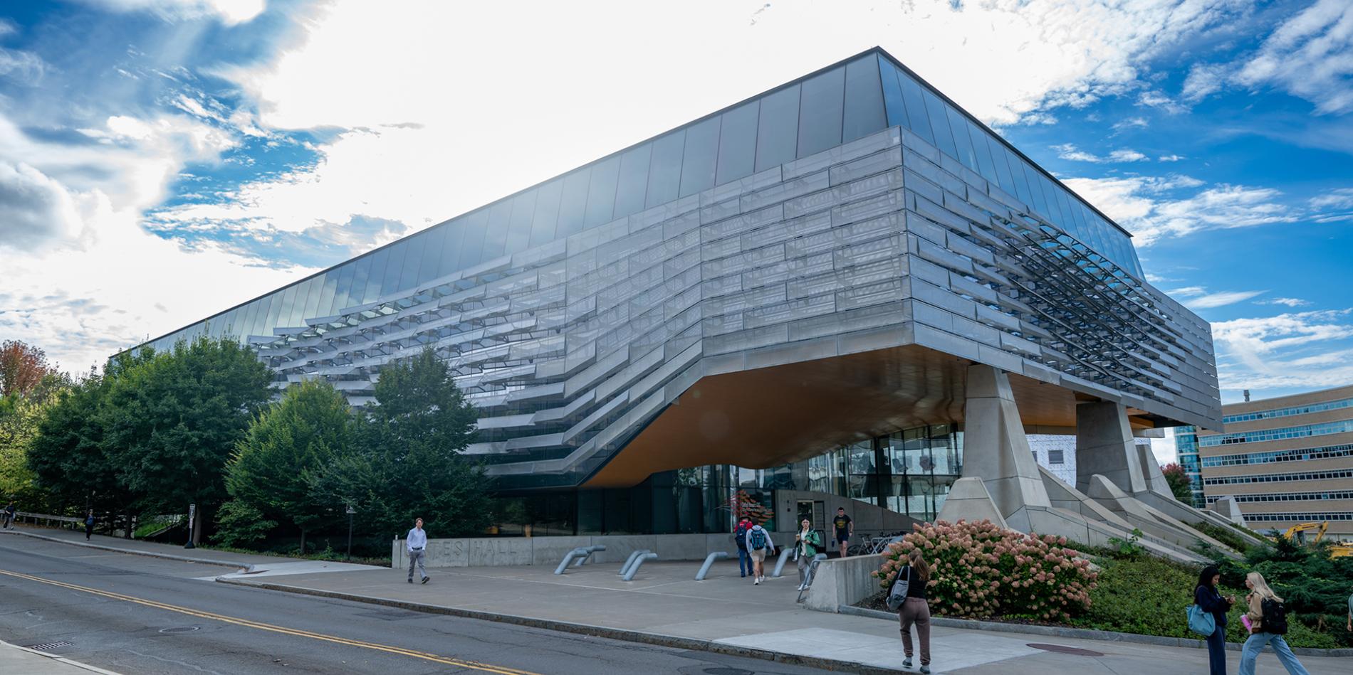 South view of Gates Hall (showing fins) on a sunny day.