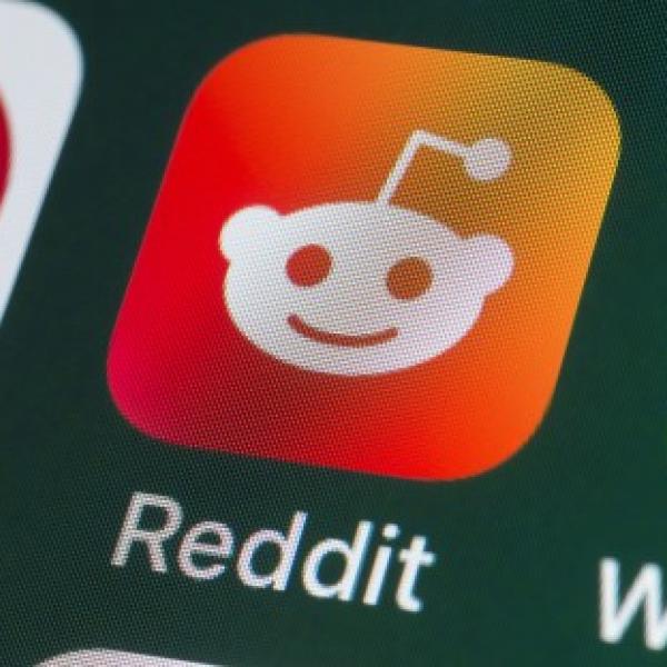 Three app icons on a phone screen: pinterest, reddit, and whatsapp. 