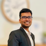 A color photo of Devansh Agarwal in front of a blurred background