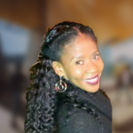 A color photo of Sharlane Cleare with a blurred background