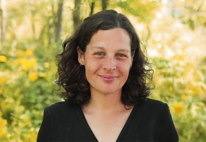 A color photo of Marcie Lanham outside