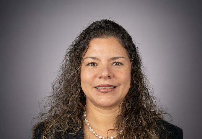 A color photo of Yl Guanchez in front of a grey background