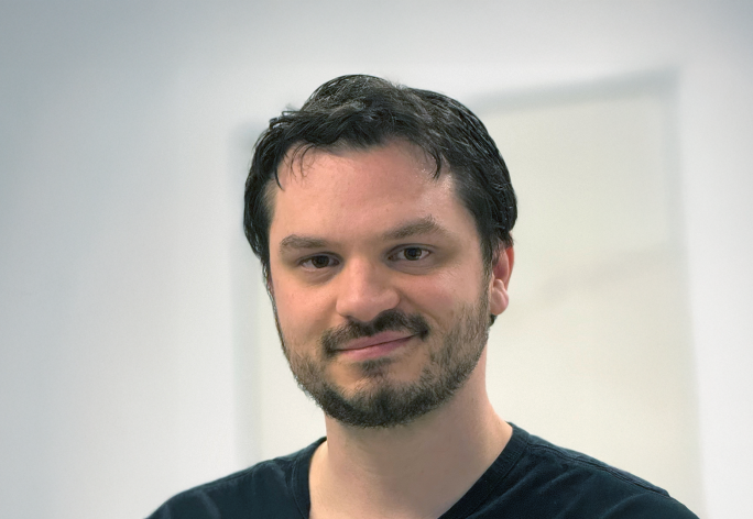 A photo of Abe Davis, a man with dark brown hair.